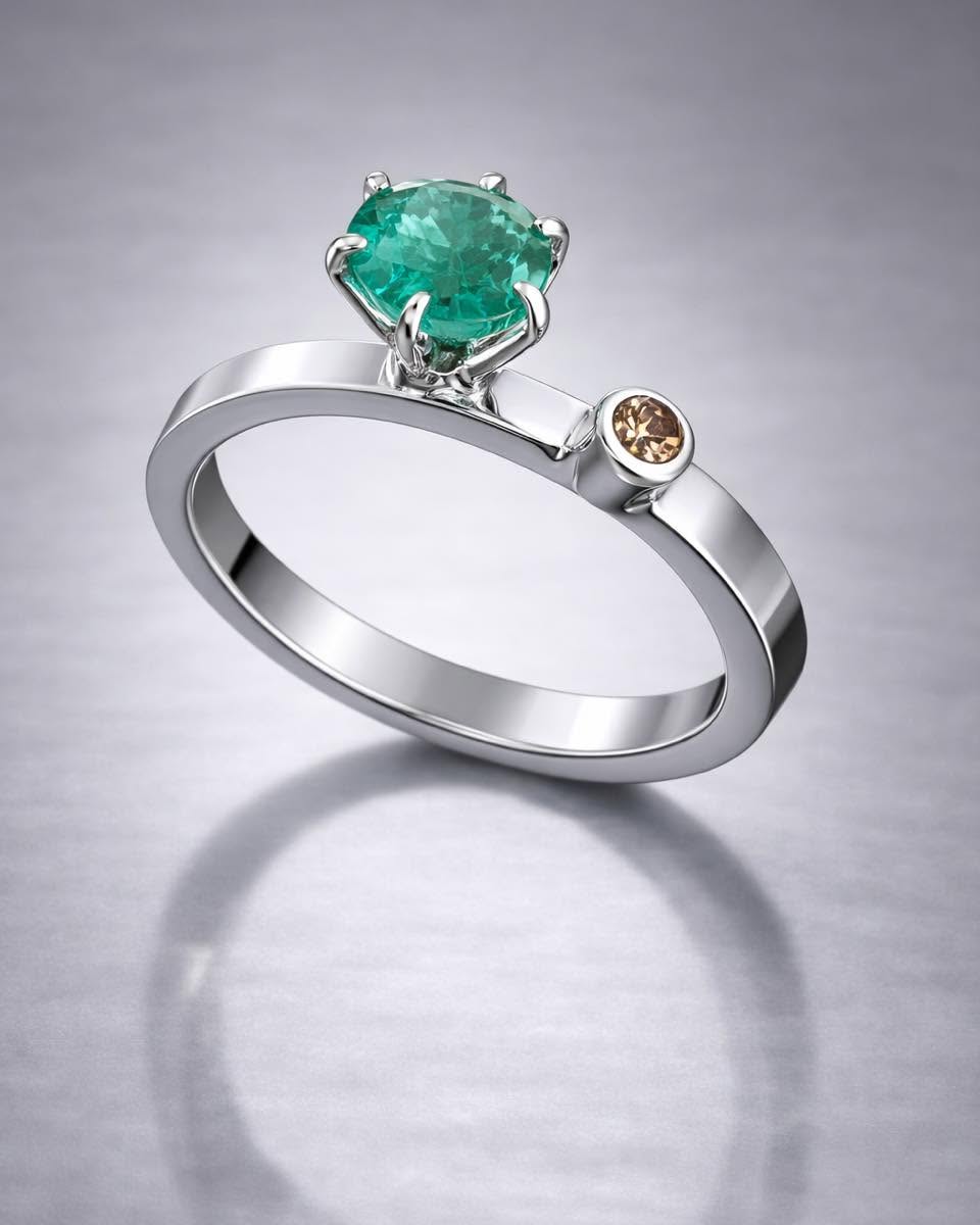 Emerald and champagne diamond ring in white metal