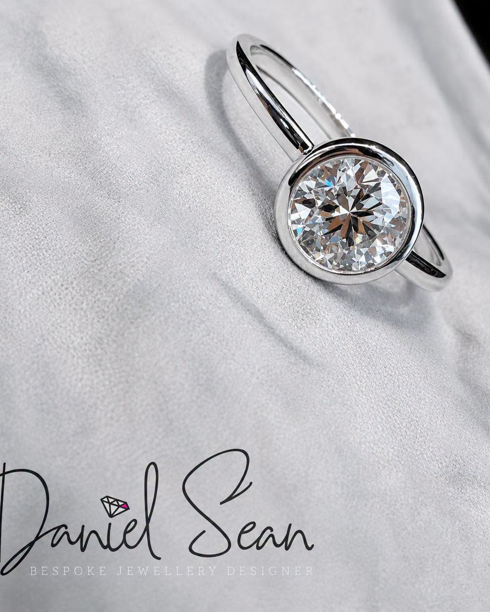 Round brilliant diamond ring in bezel setting